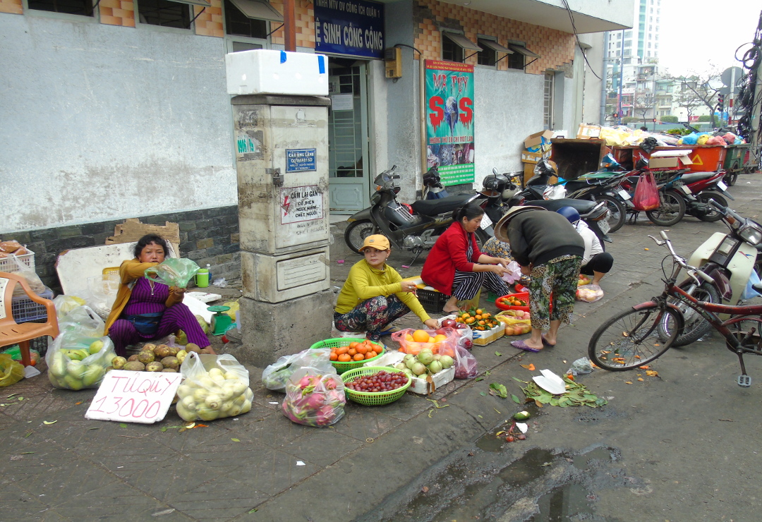 Trying to earn a living selling fruit and vegtables on a street corner. Picture by Ian Russell (charityneeds.com).