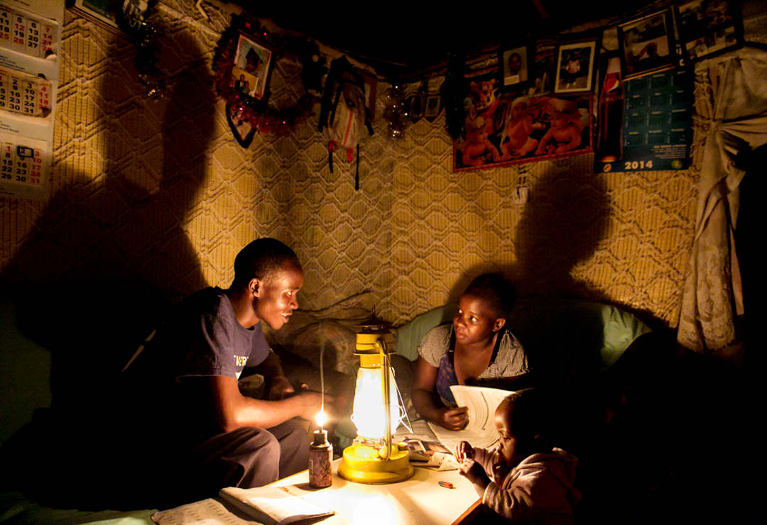 Reading by kerosene lamp